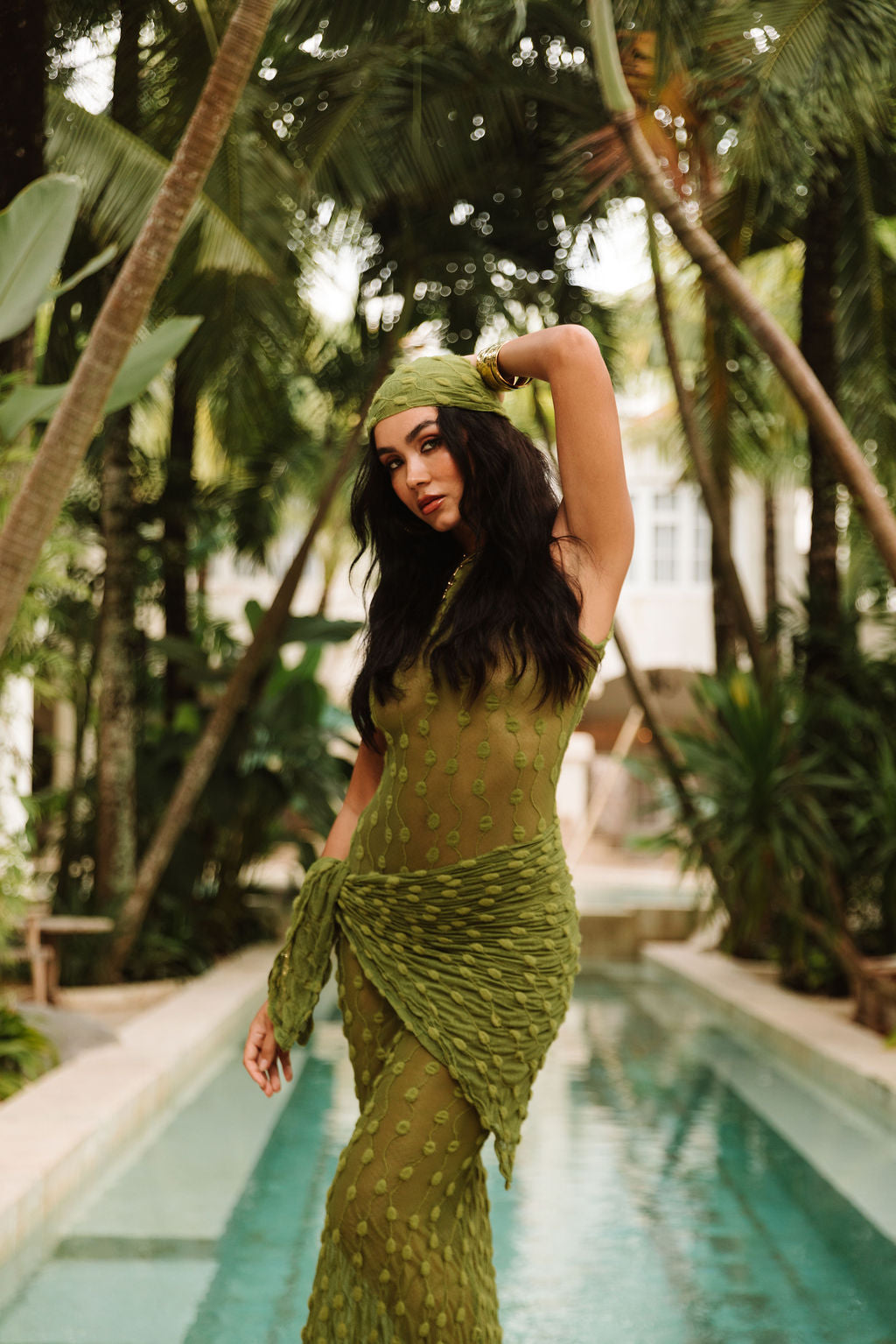 The Amalfi Dress in Positano Olive, at the poolside.