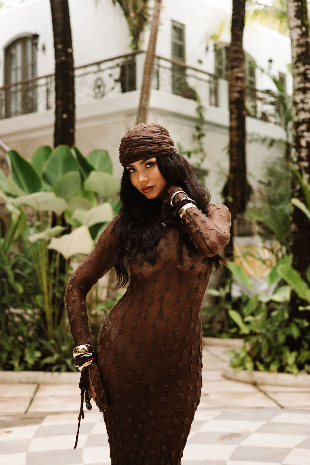 The Dolce Scarf in Ravello Cocoa, worn as a head scarf.